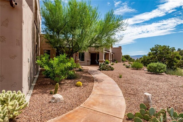 view of front of house featuring stucco siding