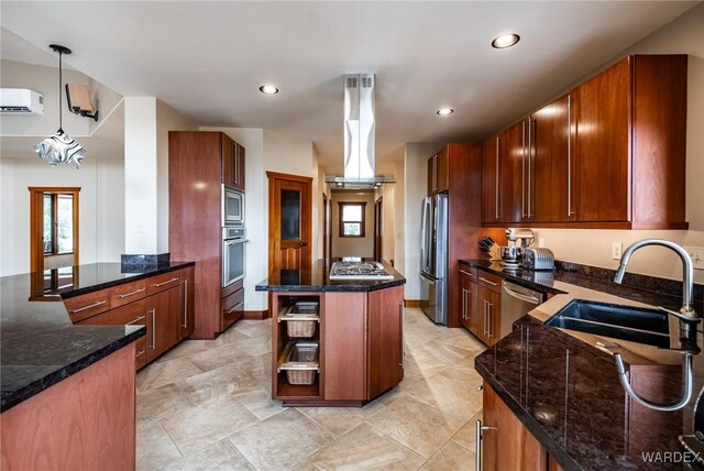 kitchen with stainless steel appliances, a sink, hanging light fixtures, a center island, and island exhaust hood