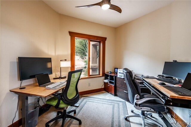 home office with baseboards and a ceiling fan