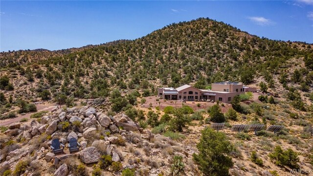 mountain view featuring a forest view