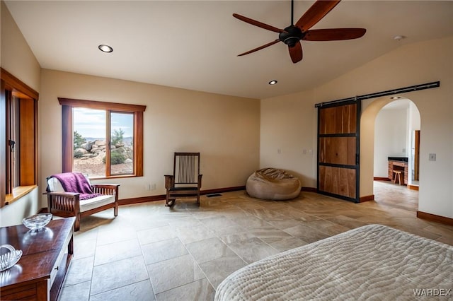 bedroom featuring a barn door, baseboards, arched walkways, vaulted ceiling, and recessed lighting