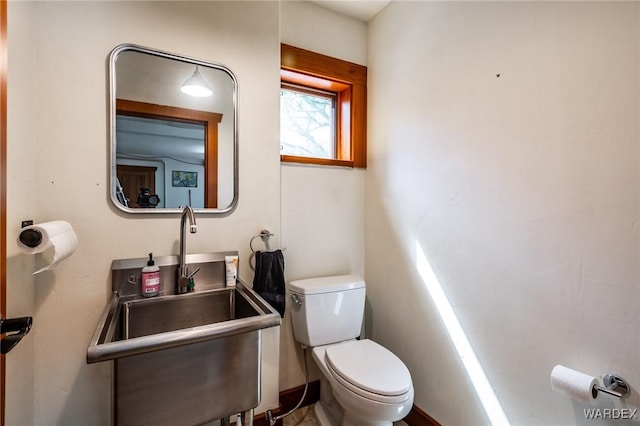 bathroom with a sink and toilet