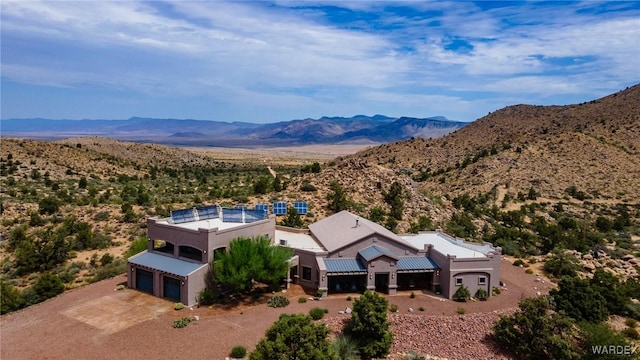 birds eye view of property featuring a mountain view