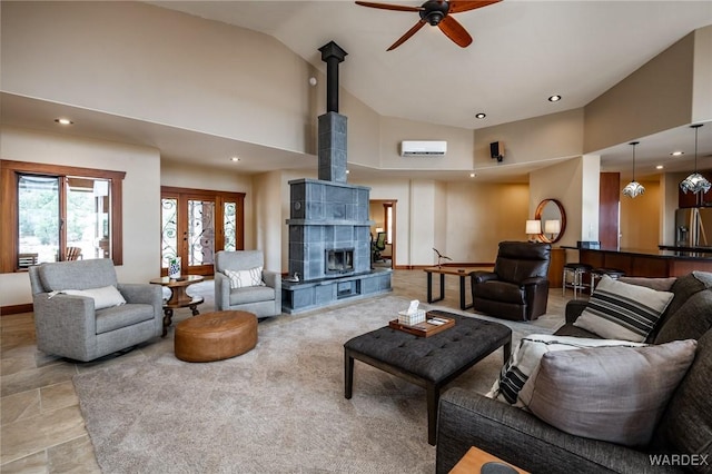 living room featuring high vaulted ceiling, recessed lighting, an AC wall unit, and baseboards