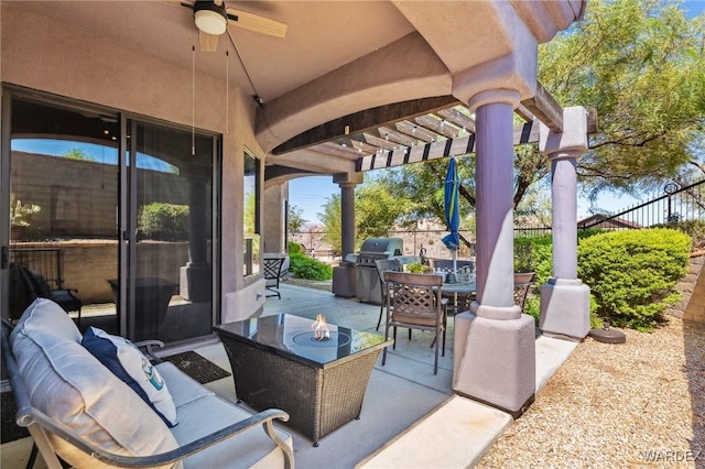 view of patio featuring outdoor dining space, fence, area for grilling, and a pergola