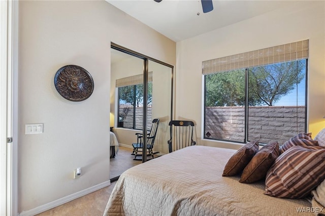 bedroom featuring ceiling fan, a closet, and baseboards