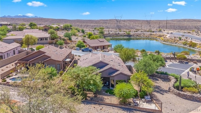 aerial view featuring a residential view and a water and mountain view