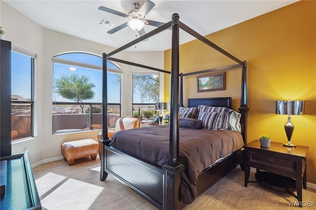 bedroom with baseboards, visible vents, and ceiling fan