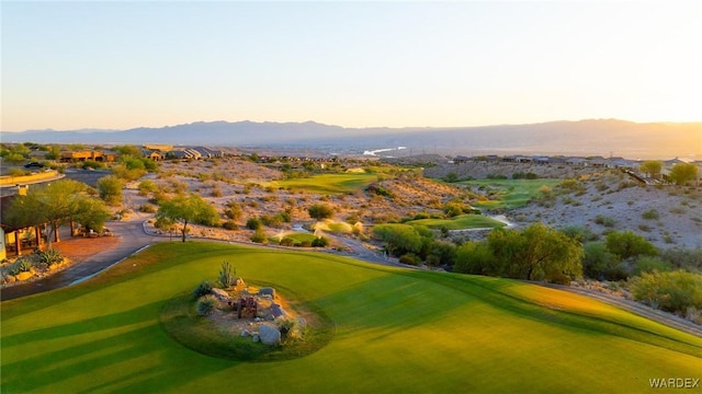 view of home's community featuring view of golf course and a mountain view