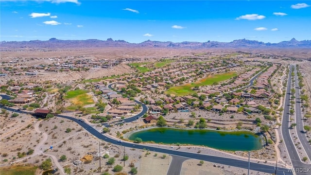 birds eye view of property featuring a water and mountain view