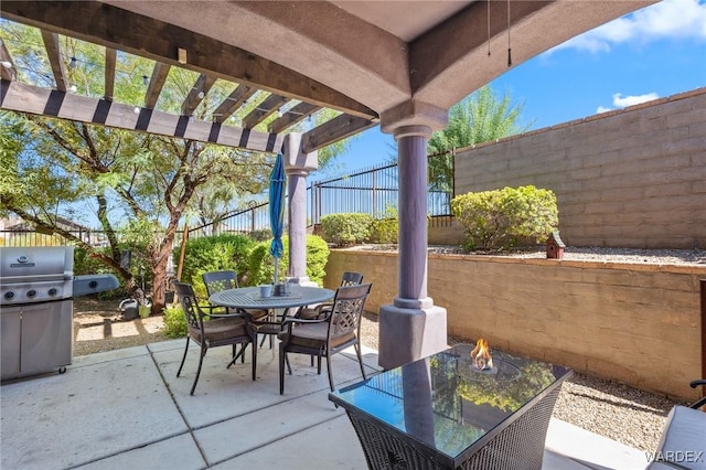 view of patio / terrace featuring outdoor dining space, area for grilling, a fenced backyard, and a pergola