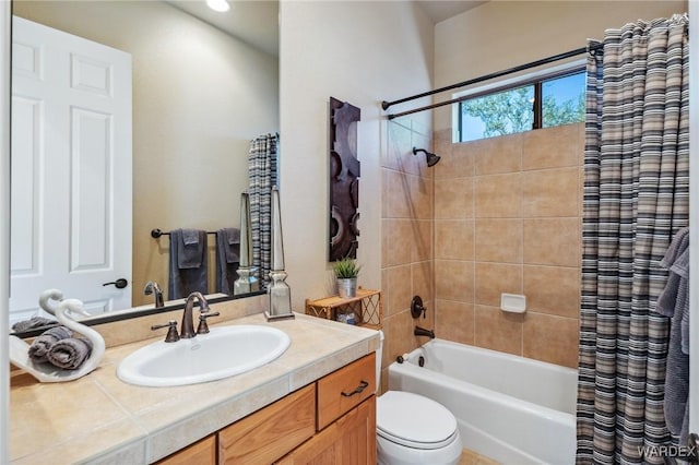 bathroom featuring toilet, shower / tub combo, and vanity