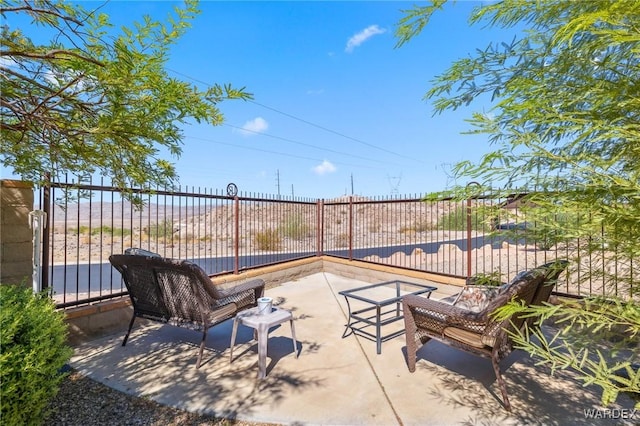 view of patio featuring fence