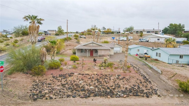 ranch-style home with driveway and a residential view
