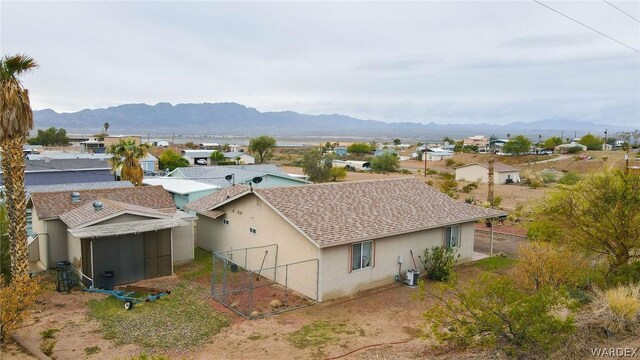 birds eye view of property with a residential view and a mountain view