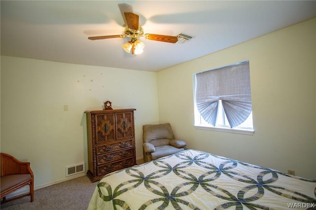 carpeted bedroom featuring baseboards, visible vents, and a ceiling fan