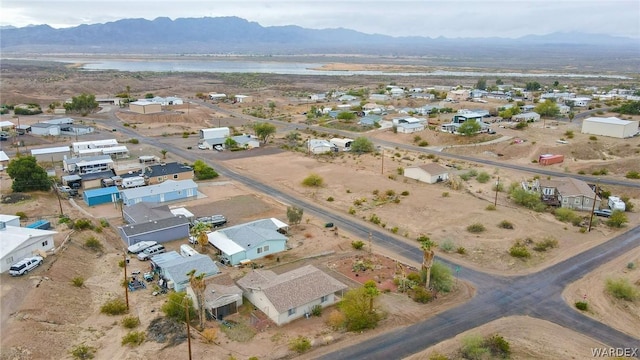 aerial view featuring a water and mountain view