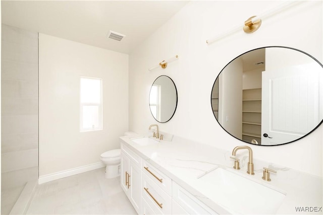 bathroom with baseboards, visible vents, a sink, and toilet