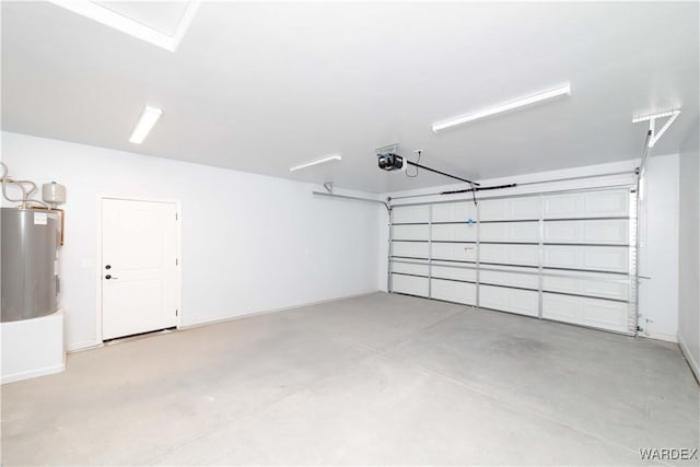 garage featuring a garage door opener and electric water heater