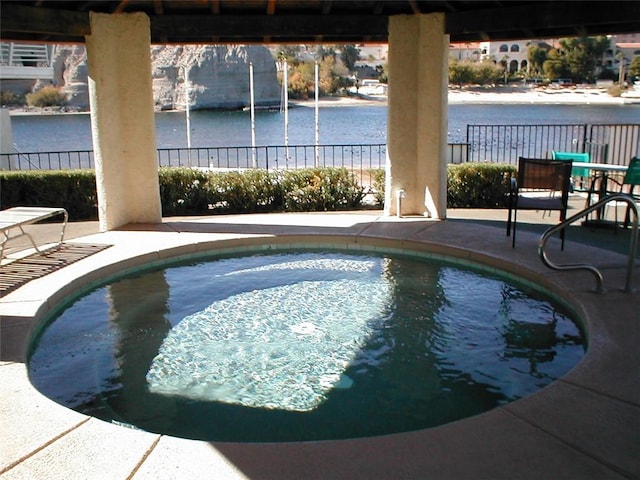 441 Moser Ave Unit B3, Bullhead City, AZ 86429 - view of swimming pool with fence, a water view, and a patio
