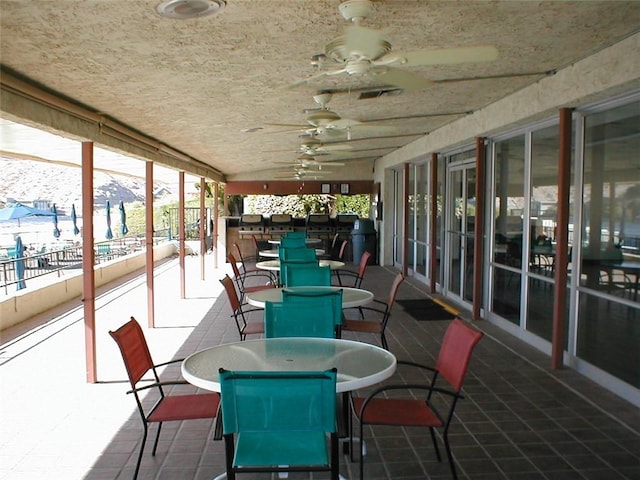 441 Moser Ave Unit B3, Bullhead City, AZ 86429 - sunroom featuring outdoor dining space, healthy amount of natural light, and a ceiling fan