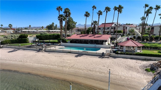 441 Moser Ave Unit B3, Bullhead City, AZ 86429 - community pool featuring fence, a mountain view, a gazebo, and a residential view