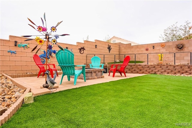 view of playground featuring a yard, a fire pit, fence, and a patio area