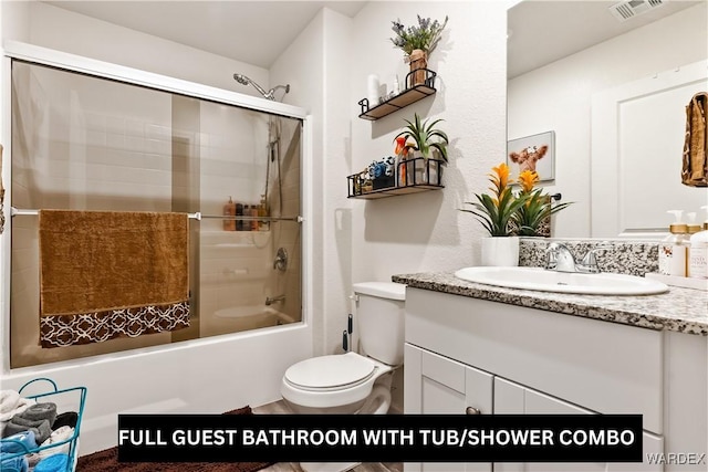 full bath with vanity, toilet, visible vents, and shower / washtub combination