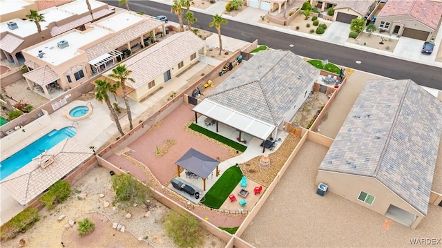 birds eye view of property with a residential view