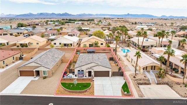 drone / aerial view with a mountain view and a residential view