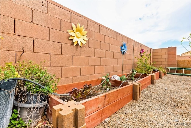 view of yard featuring a vegetable garden and a fenced backyard