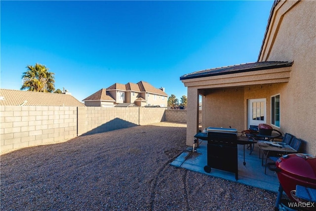 view of yard with a patio and a fenced backyard