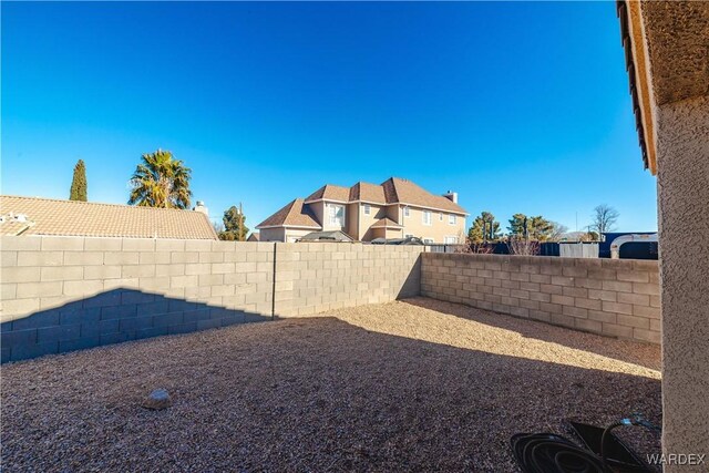 view of yard featuring a fenced backyard