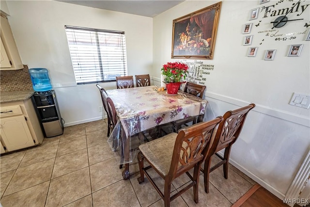 dining area featuring light tile patterned floors