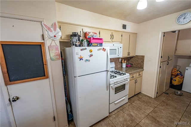 kitchen with white appliances, light countertops, backsplash, and cream cabinets