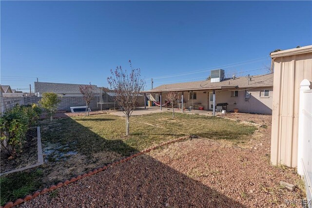 view of yard featuring cooling unit, a patio area, and a fenced backyard