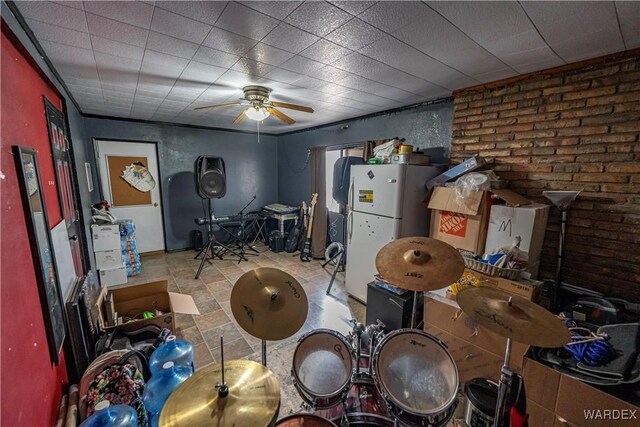 miscellaneous room featuring a ceiling fan