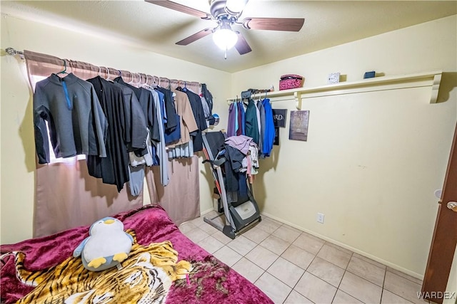 spacious closet featuring ceiling fan and light tile patterned flooring