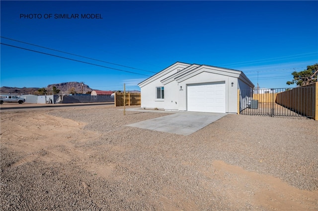exterior space with central air condition unit and fence