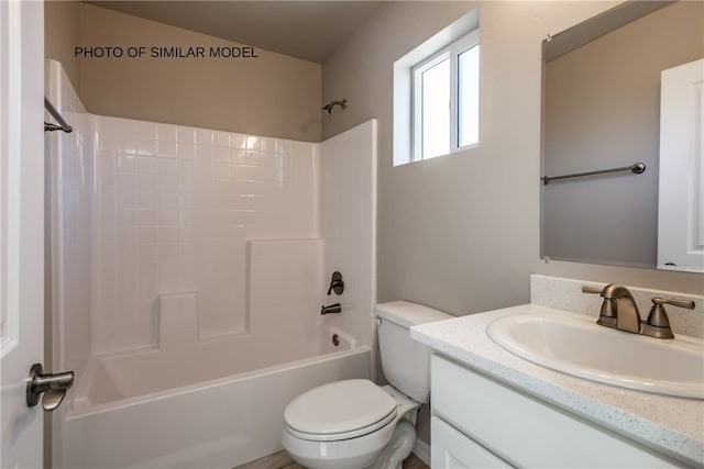 full bath featuring toilet, shower / bathing tub combination, and vanity