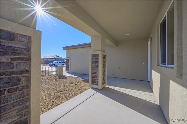 view of patio featuring fence