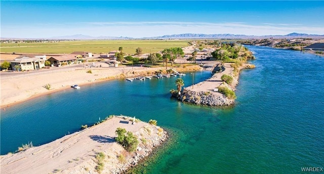 aerial view featuring a water and mountain view