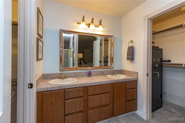 full bath featuring double vanity and a sink