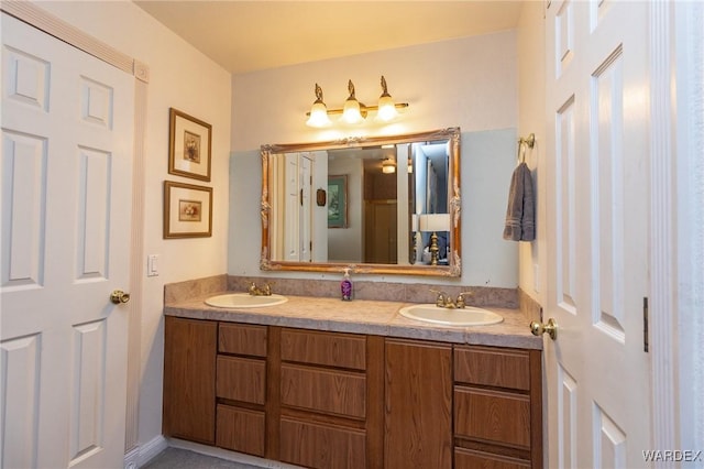 bathroom with double vanity and a sink