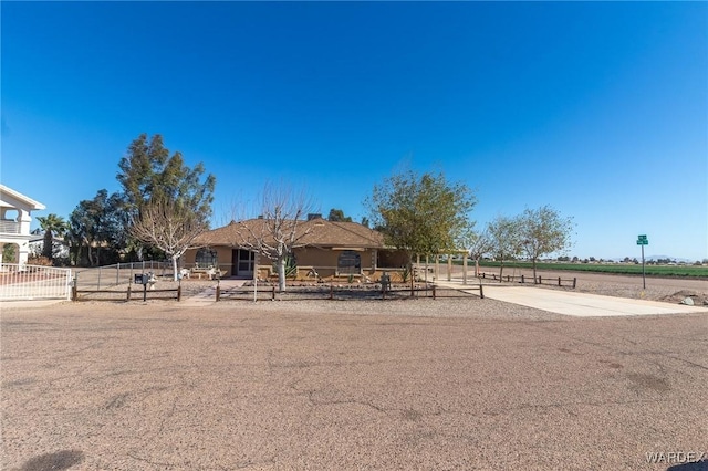 view of front of home with fence