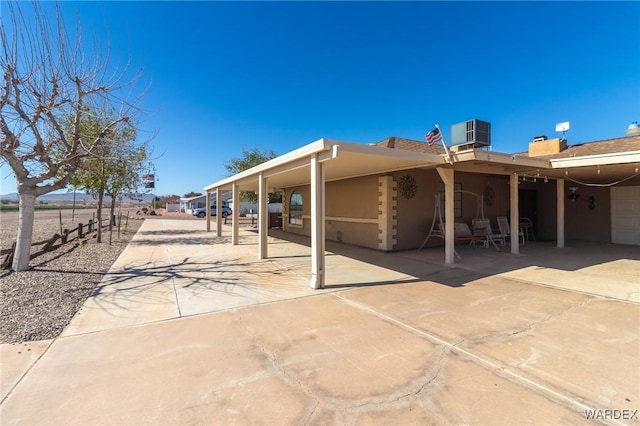 exterior space with driveway and cooling unit