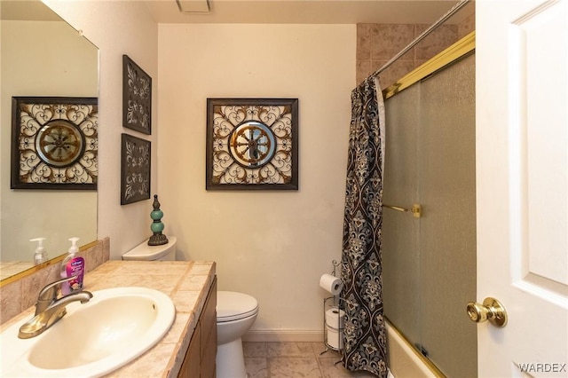 full bath with baseboards, toilet, tile patterned floors, shower / bath combo with shower curtain, and vanity