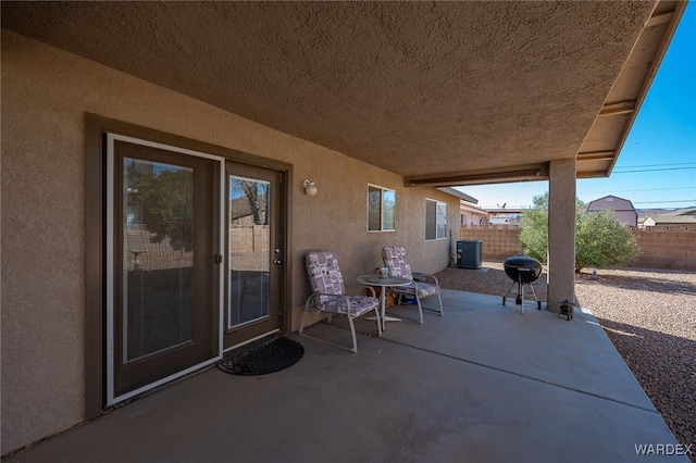 view of patio featuring a fenced backyard and central AC