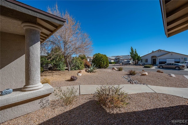 view of yard featuring a residential view