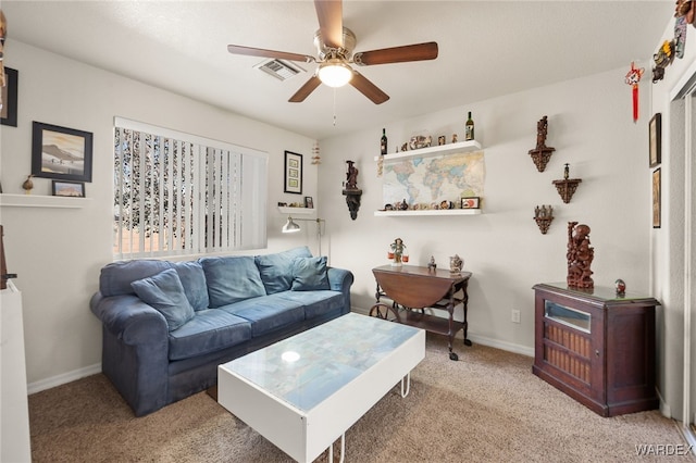 living area featuring light carpet, ceiling fan, visible vents, and baseboards